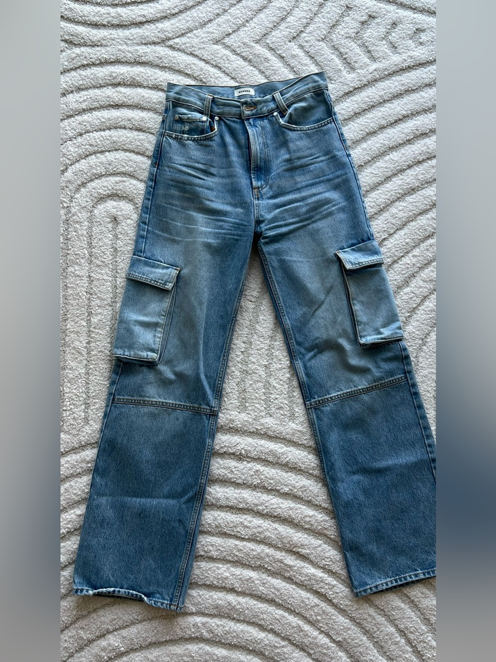 Sandro high rise cargo pockets light wash denim jeans.
